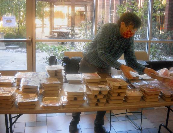 Senior Nutrition staff prepares prepackaged meals