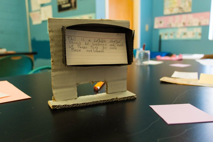 a model of a student's invention made from cardboard and paper.