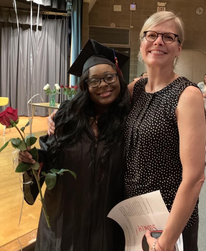 voa staff with student at VOA High School graduation