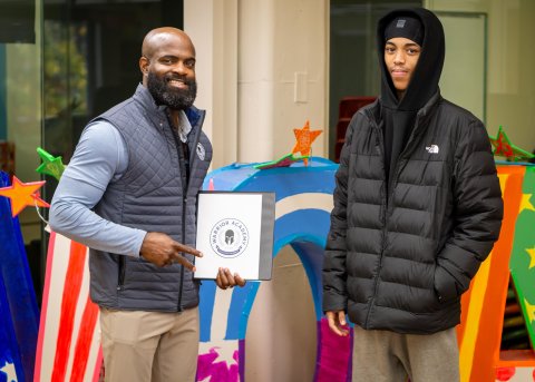 Jeremiah Harris with student in front of VOA