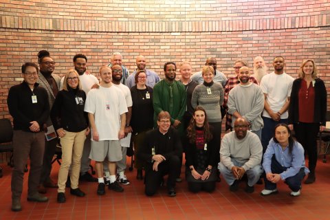 a group of people standing together for a photo