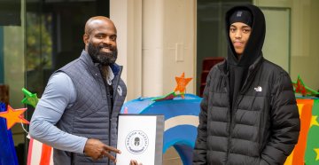 Jeremiah Harris with student in front of VOA