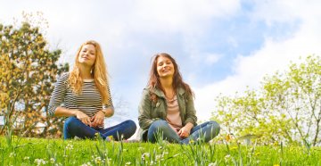 Youth sitting on a hill