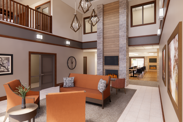 interior view of an apartment building lobby with orange chairs and couch