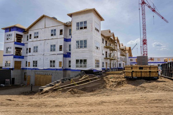 side view of a construction site of an apartment building