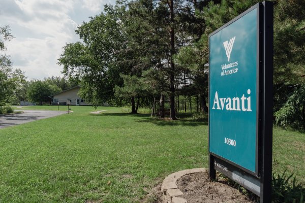 Blue sign that says Avanti near the entrance of the facility, what you see when you first arrive